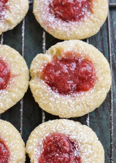 Keto Strawberry Thumbprint Cookies are the perfect sweet treat for about 2 net carbs each! Low carb sugar cookies are packed with fresh strawberry sauce and baked until soft and chewy! 