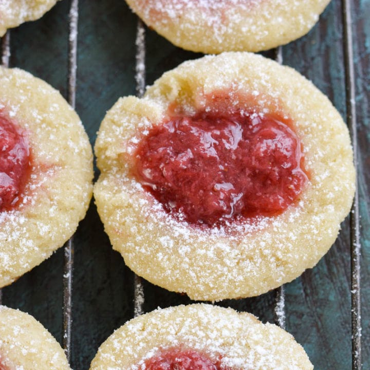 Keto Strawberry Thumbprint Cookies are the perfect sweet treat for about 2 net carbs each! Low carb sugar cookies are packed with fresh strawberry sauce and baked until soft and chewy! 