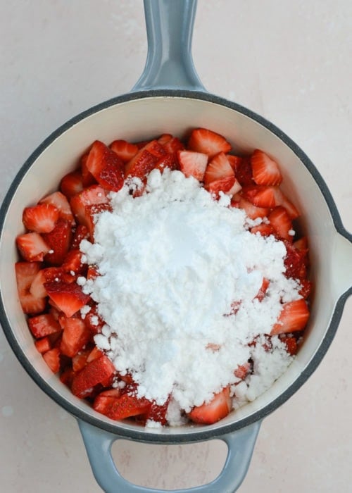 strawberries, powdered monk fruit, and vanilla extract in a saucepan