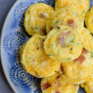 These savory Bacon Egg and Zucchini Bites are loaded with fresh veggies, salty bacon and tons of each! Each mini muffin has just 0.2 net carbs each making them an amazing keto breakfast option!