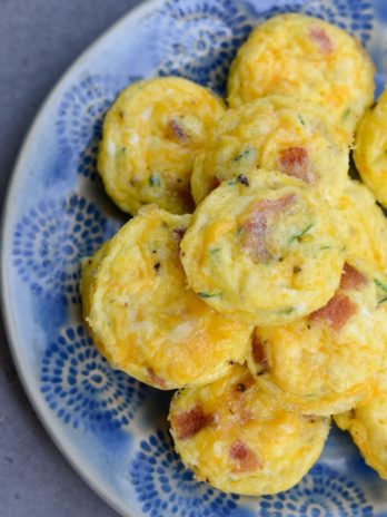 These savory Bacon Egg and Zucchini Bites are loaded with fresh veggies, salty bacon and tons of each! Each mini muffin has just 0.2 net carbs each making them an amazing keto breakfast option!