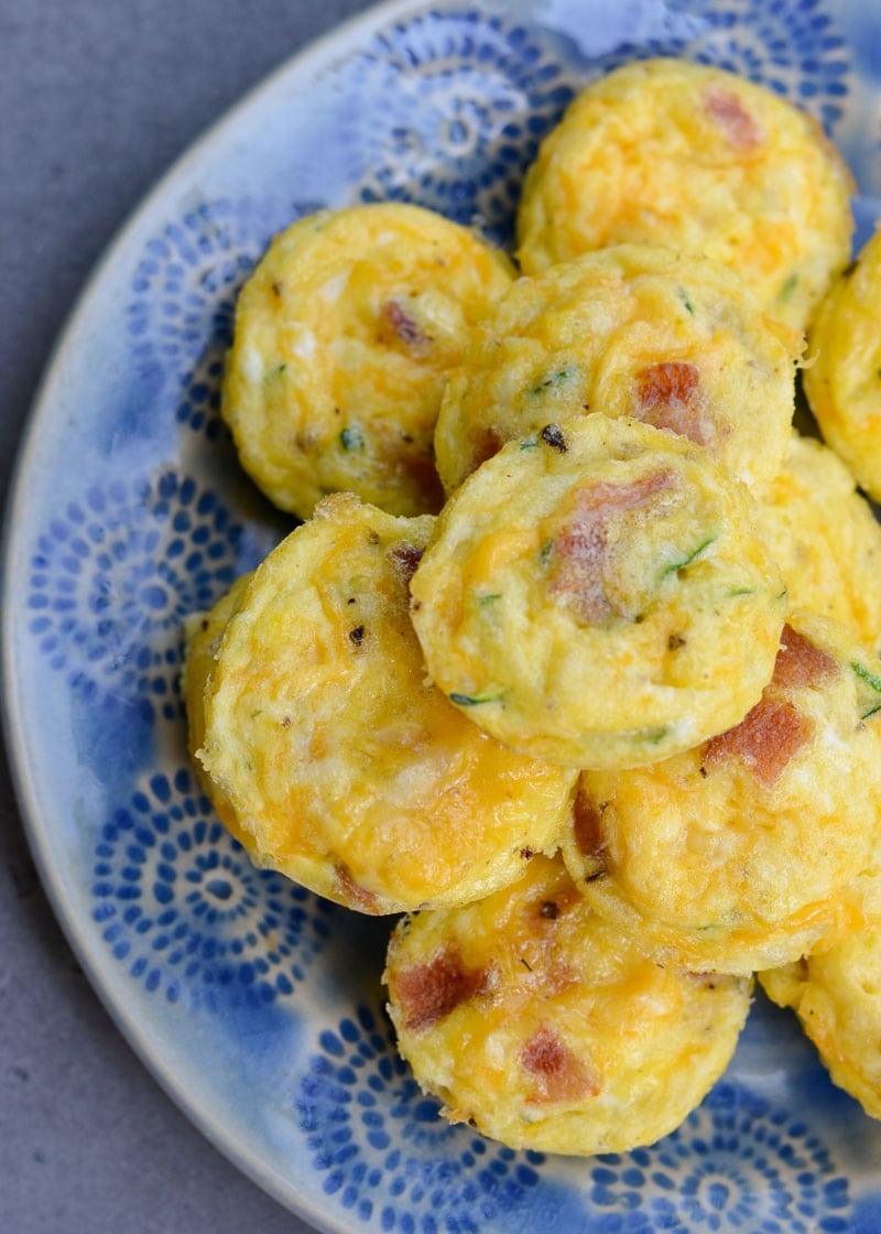 These savory Bacon Egg and Zucchini Bites are loaded with fresh veggies, salty bacon and tons of each! Each mini muffin has just 0.2 net carbs each making them an amazing keto breakfast option!