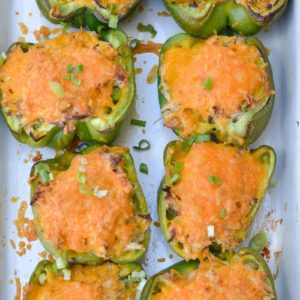 These six ingredient Green Chile Chicken Stuffed Peppers have under 5 net carbs per serving! Packed with chicken, cheese and spices this is an easy dinner your entire family will love!