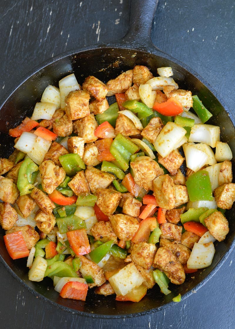 This One Pan Cheesy Fajita Chicken is a delicious combo of flavorful chicken, fresh veggies and an amazing cheese sauce your family will devour! Great for low carb meal-prepping and clean up is a breeze!