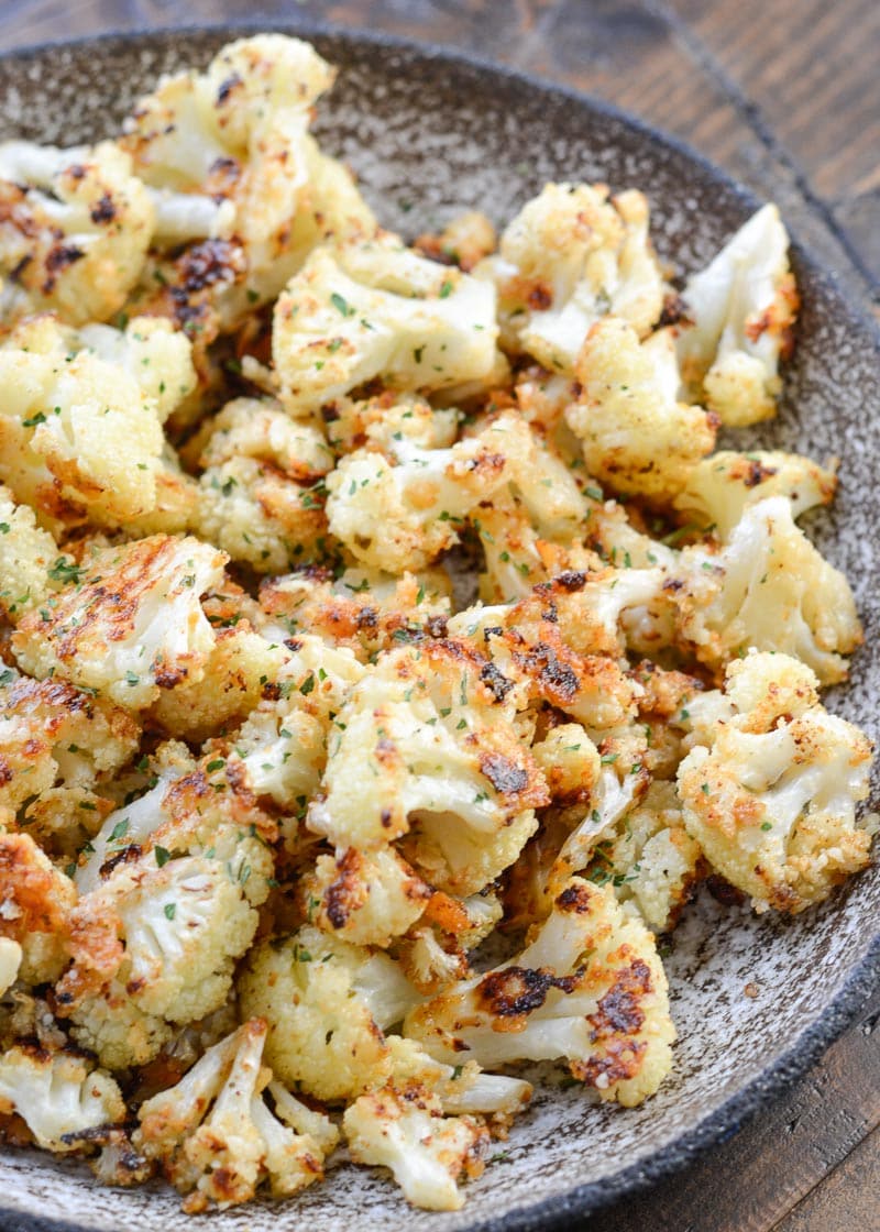 Parmesan Roasted Cauliflower is perfectly seasoned and roasted until crisp and full of flavor! Each serving has about 3 net carbs, making it an excellent keto side dish! 