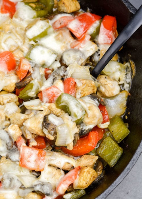 Try this Chicken Philly Cheesesteak Skillet packed with pan seared chicken, mushrooms, bell peppers and onions. This easy one pan recipe has less than 5 net carbs per serving! 