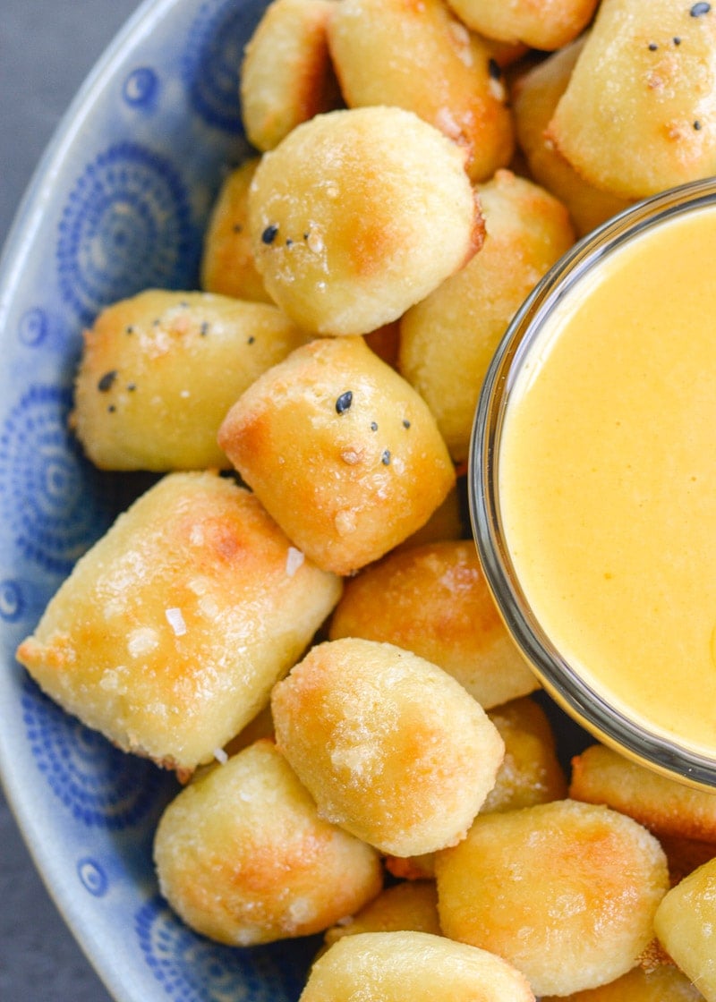 These soft Keto Pretzel Bites with Cheese Sauce are the perfect low carb appetizer! Enjoy 8 bites with cheese dip for less than 5 net carbs!