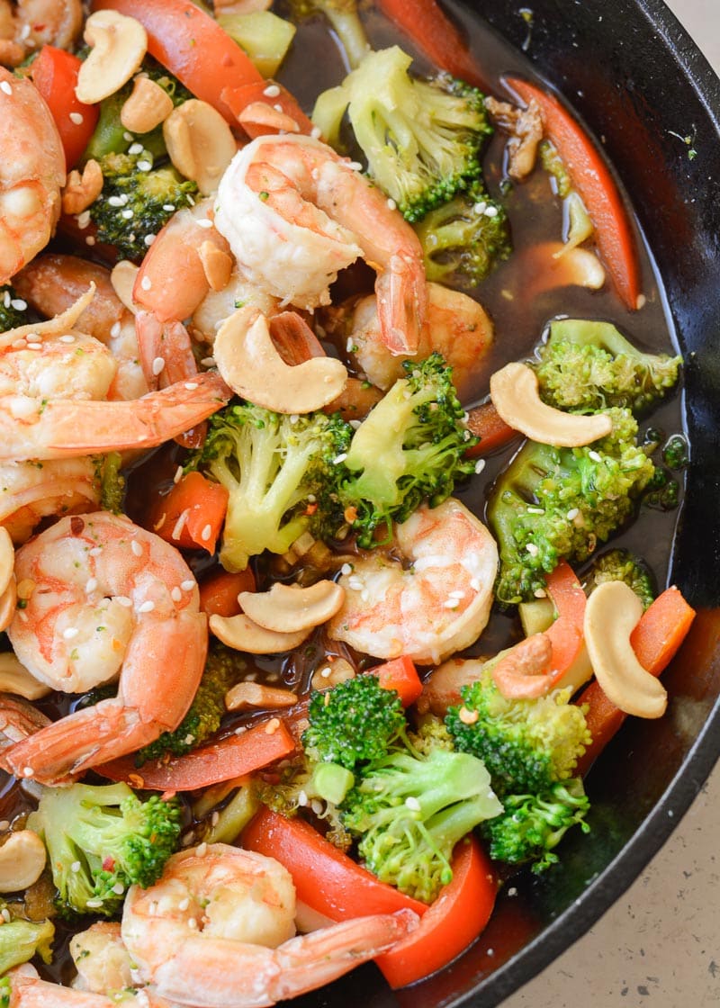 Keto Shrimp and Broccoli Stir-Fry is a quick and easy one pan recipe that has about 6 net carbs per serving! Loaded with vegetables and a sesame garlic sauce, this will become a family favorite!