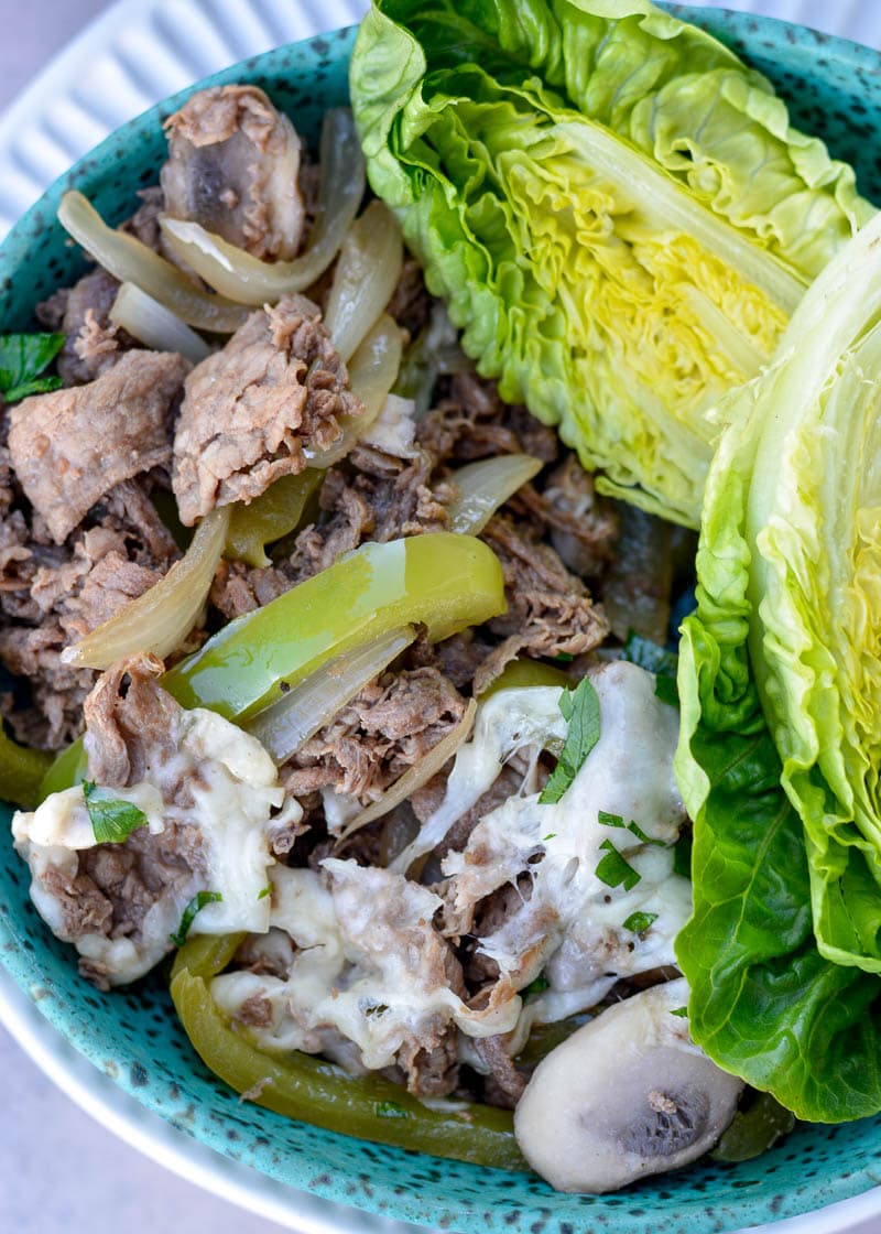 These one-pan Philly Cheesesteak Lettuce Wraps are the perfect meal prep lunch or dinner! Filled with sizzling beef, veggies, and cheese, this quick low-carb meal has less than 4 net carbs!
