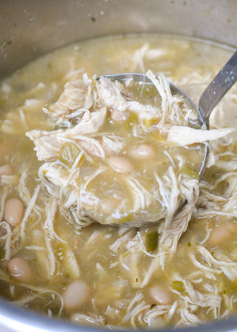 This Instant Pot White Bean Chicken Chili recipe is so easy! Loaded with chicken, beans, flavorful green chiles and spices this soup is ready in under 30 minutes and always a crowd pleaser! 