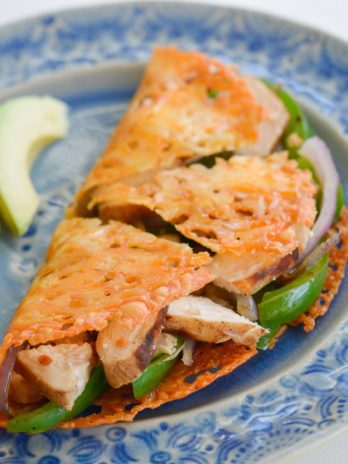 Learn how to make the perfect Keto Quesadilla! This low carb recipe is loaded with tender chicken, bell peppers and onions! This easy, low carb recipe has just 4 net carbs per serving!