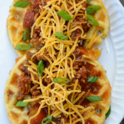 Enjoy a crispy, cheesy chaffle covered with savory keto chili for about three net carbs! These Keto Chili Cheese Chaffles are quick, easy and so satisfying!