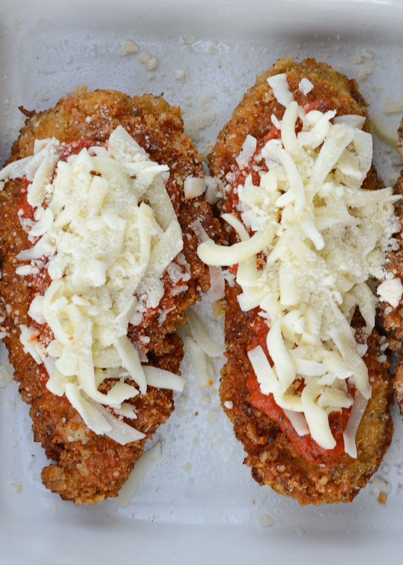 This Keto Chicken Parmesan is breaded and fried until perfectly crisp and smothered in marinara and mozzarella! At just five net carbs per serving this is a classic dish your entire family will love!