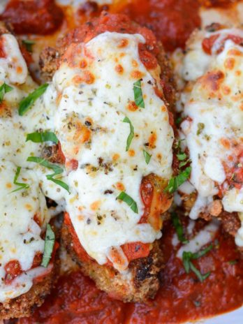 This Keto Chicken Parmesan is breaded and fried until perfectly crisp and smothered in marinara and mozzarella! At just five net carbs per serving this is a classic dish your entire family will love!