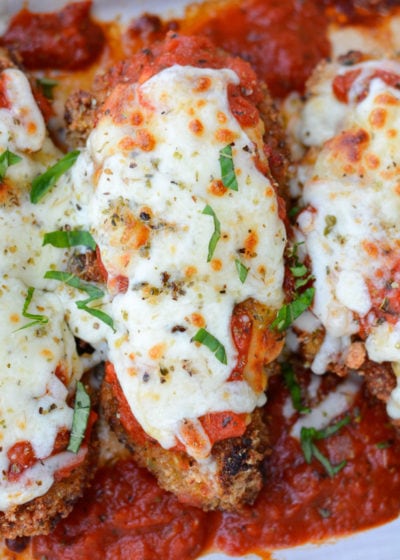 This Keto Chicken Parmesan is breaded and fried until perfectly crisp and smothered in marinara and mozzarella! At just five net carbs per serving this is a classic dish your entire family will love!