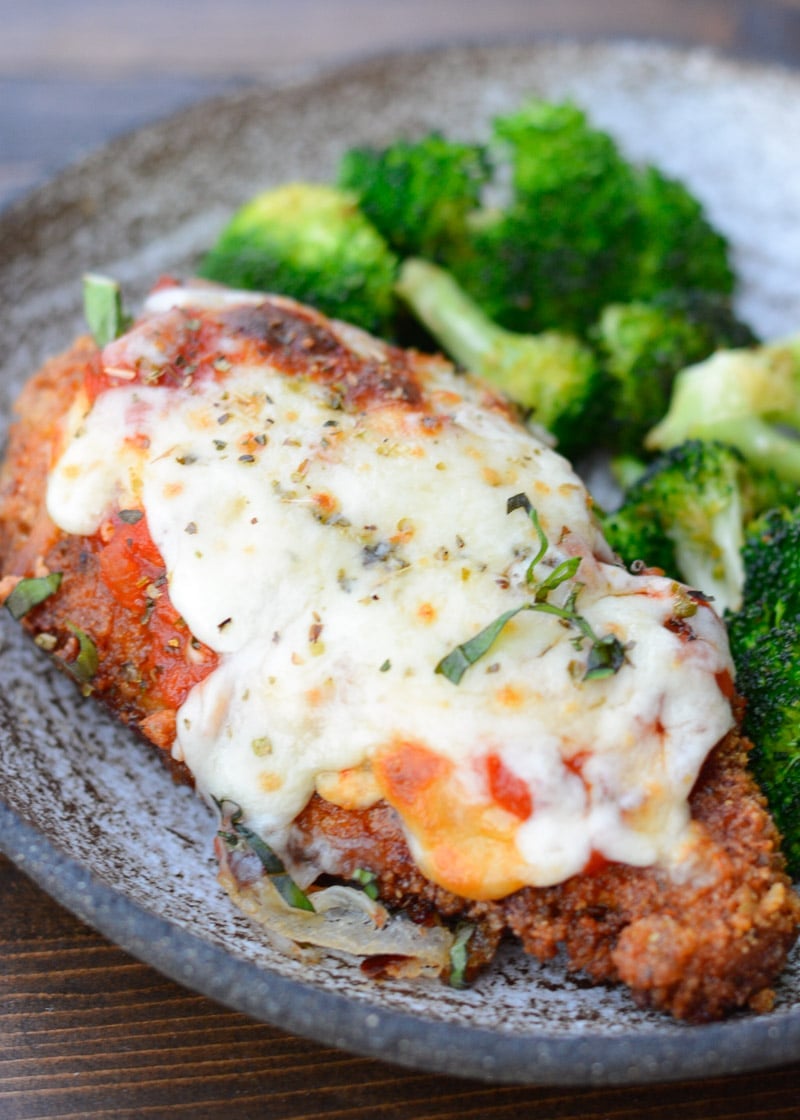 This Keto Chicken Parmesan is breaded and fried until perfectly crisp and smothered in marinara and mozzarella! At just five net carbs per serving this is a classic dish your entire family will love!