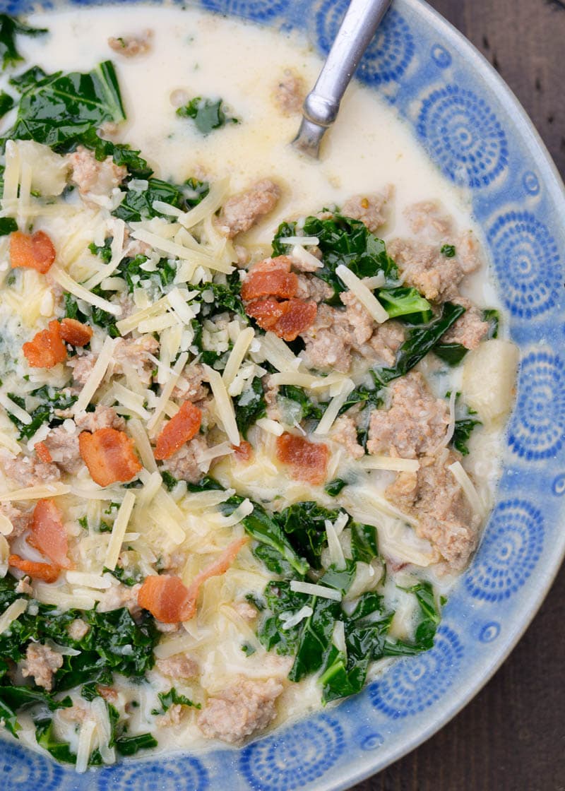 This Instant Pot Zuppa Toscana is loaded with bacon, sausage, garlic and kale! This keto-friendly, low carb soup requires just 5 minutes of pressure cooking and has about 6 net carbs per serving!