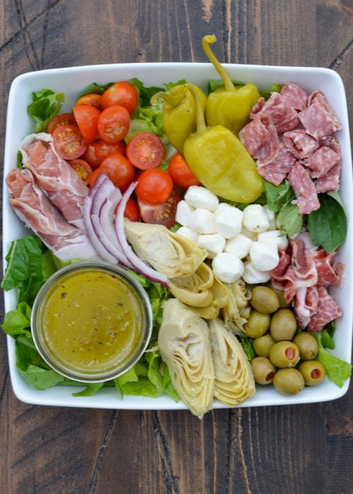 Finish the Keto Antipasto Salad with a protein boost with mozzarella balls, deli meats, and a delicious low-carb lemon vinaigrette!