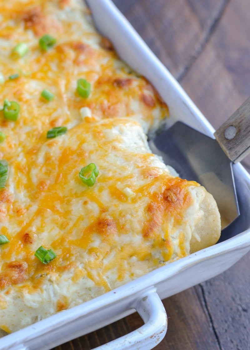 Keto Sour Cream Chicken Enchiladas are an easy dinner you'd never guess are actually low carb! This easy chicken dish is loaded with shredded chicken, green chiles, sour cream, and cheese! Enjoy two loaded enchiladas for under 8 net carbs!