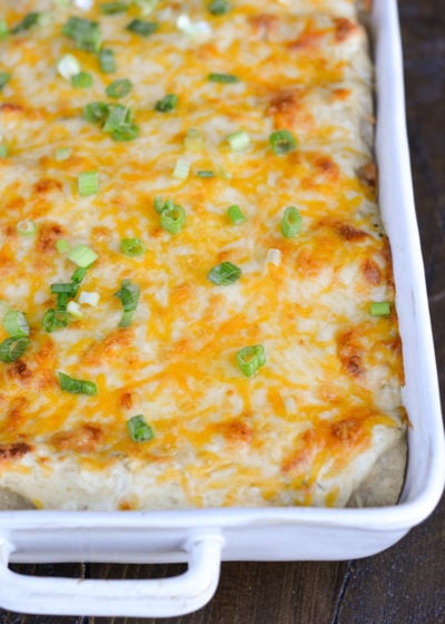 Keto Sour Cream Chicken Enchiladas are an easy dinner you'd never guess are actually low carb! This easy chicken dish is loaded with shredded chicken, green chiles, sour cream, and cheese! Enjoy two loaded enchiladas for under 8 net carbs!