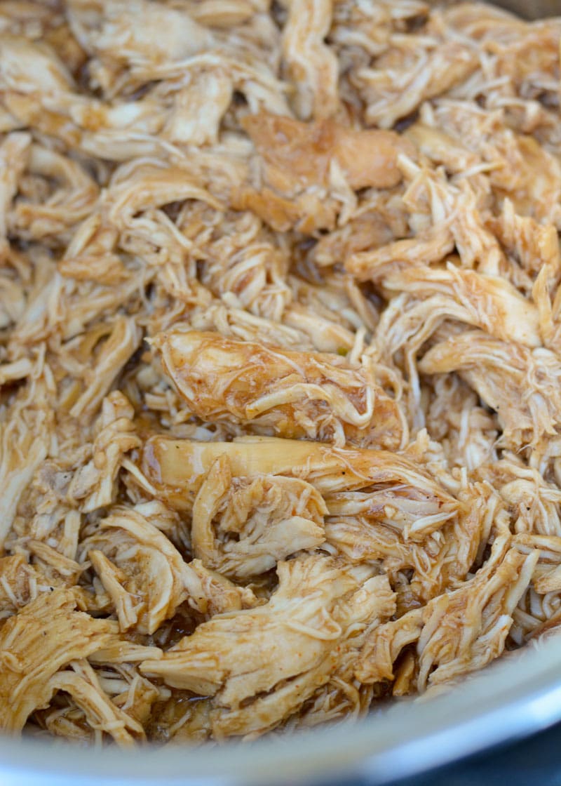 This low carb Instant Pot BBQ Chicken requires just five simple ingredients and less than 15 minutes of cook time! Try my favorite pulled chicken recipe on a salad or wrap! 