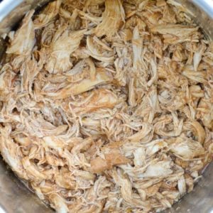 This low carb Instant Pot BBQ Chicken requires just five simple ingredients and less than 15 minutes of cook time! Try my favorite pulled chicken recipe on a salad or wrap! 