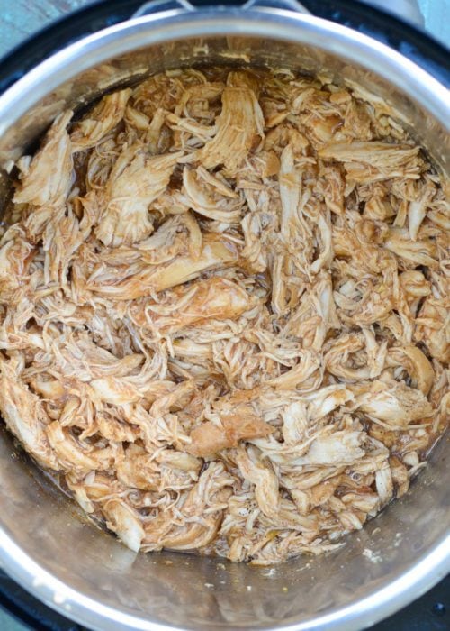 This low carb Instant Pot BBQ Chicken requires just five simple ingredients and less than 15 minutes of cook time! Try my favorite pulled chicken recipe on a salad or wrap! 