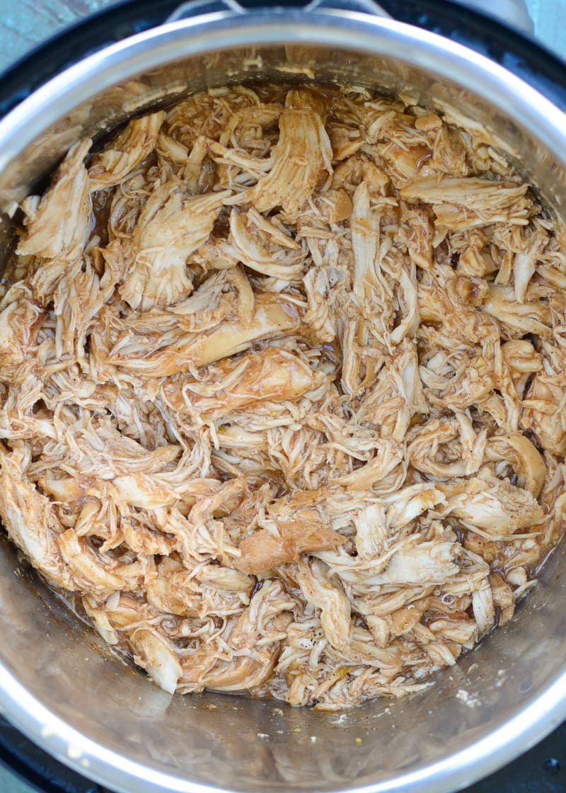 This low carb Instant Pot BBQ Chicken requires just five simple ingredients and less than 15 minutes of cook time! Try my favorite pulled chicken recipe on a salad or wrap! 