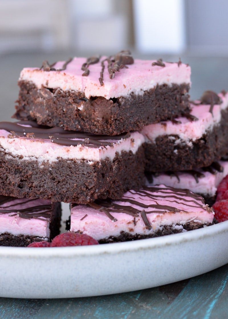 Enjoy these Keto Brownies with Frosting for a decadent sweet treat under 4 net carbs! Each grain free brownie is covered in Raspberry Frosting and rich dark chocolate. 