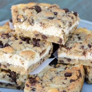 These Keto Chocolate Chip Cheesecake Bars combine sweet and delicious chocolate chip cookie dough with a creamy vanilla cheesecake layer! Each bar has less than 5 net carbs and is gluten free and keto-friendly! 