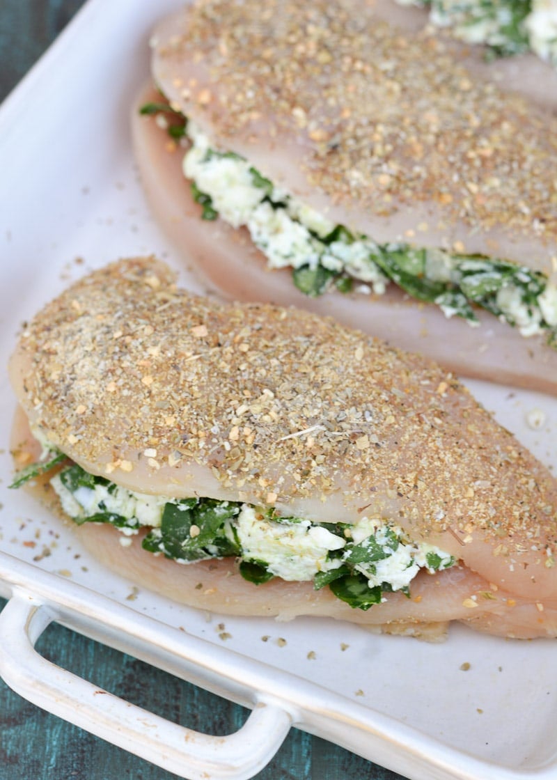 This Spinach and Feta Stuffed Chicken is packed with two different cheese, fresh spinach and garlic and is rubbed with a delicious herb mix. Ready in 30 minutes, this meal will become one of your weeknight favorites!