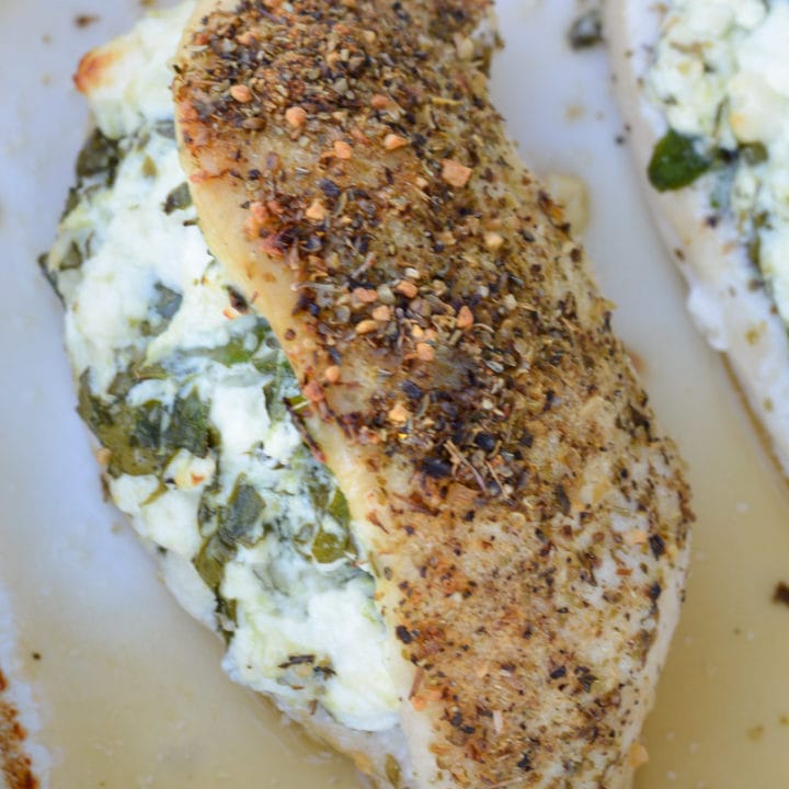 This Spinach and Feta Stuffed Chicken is packed with two different cheese, fresh spinach and garlic and is rubbed with a delicious herb mix. Ready in 30 minutes, this meal will become one of your weeknight favorites!