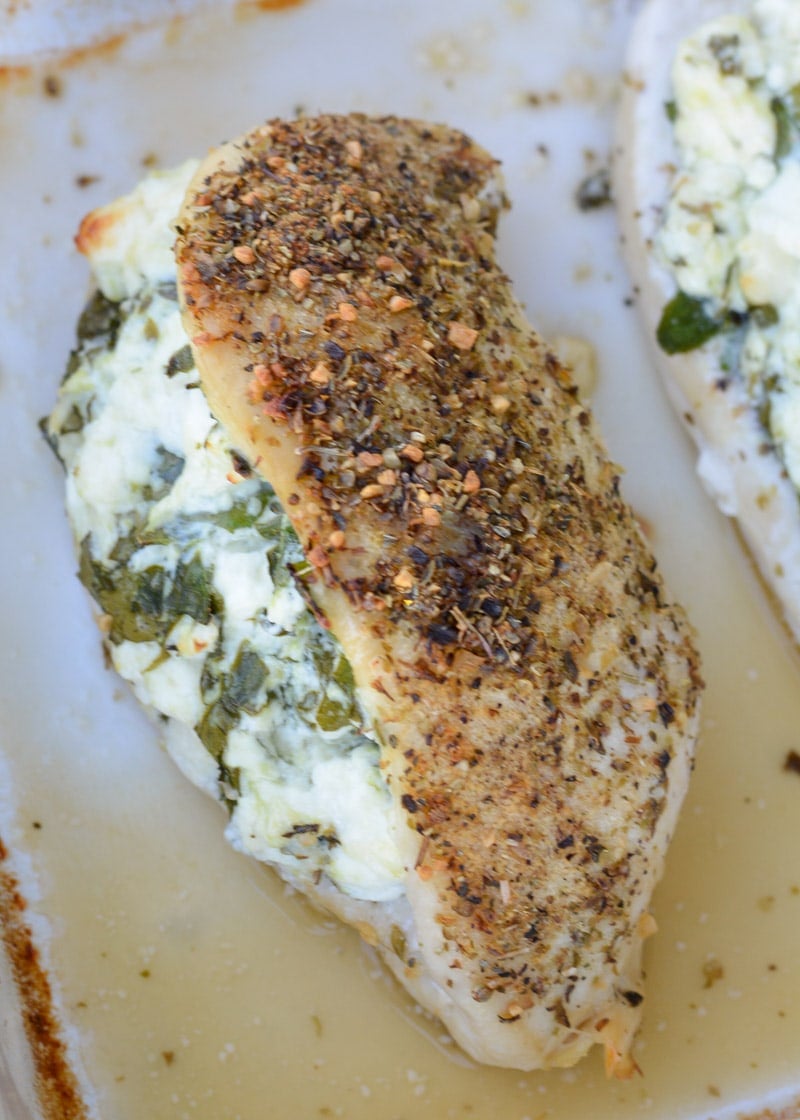 This Spinach and Feta Stuffed Chicken is packed with two different cheese, fresh spinach and garlic and is rubbed with a delicious herb mix. Ready in 30 minutes, this meal will become one of your weeknight favorites!