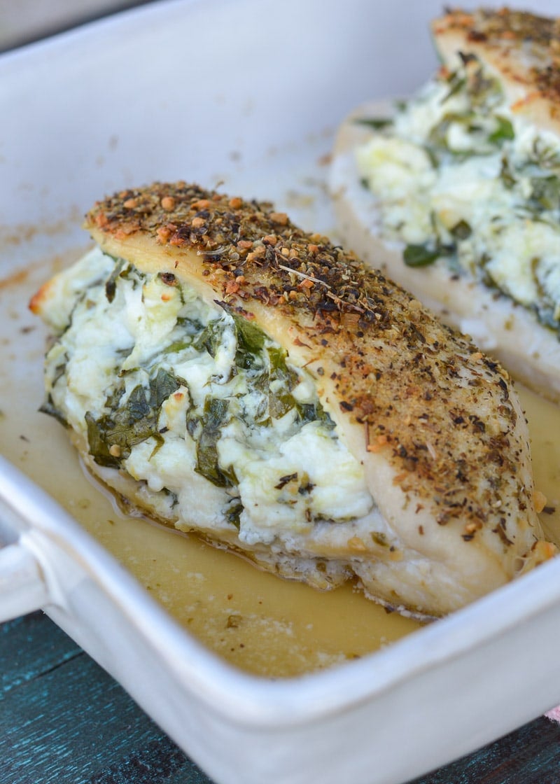 This Spinach and Feta Stuffed Chicken is packed with two different cheese, fresh spinach and garlic and is rubbed with a delicious herb mix. Ready in 30 minutes, this meal will become one of your weeknight favorites!