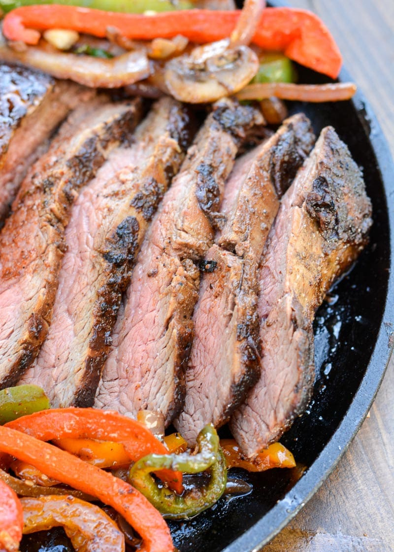 This delicious Marinated Flank Steak is a quick, low carb dish bursting with flavor! Easy keto meal prep recipe for fajitas, tacos, breakfast burritos, and more!