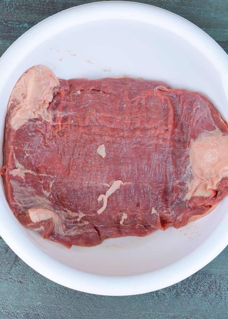 This delicious Marinated Flank Steak is a quick, low carb dish bursting with flavor! Easy keto meal prep recipe for fajitas, tacos, breakfast burritos, and more!
