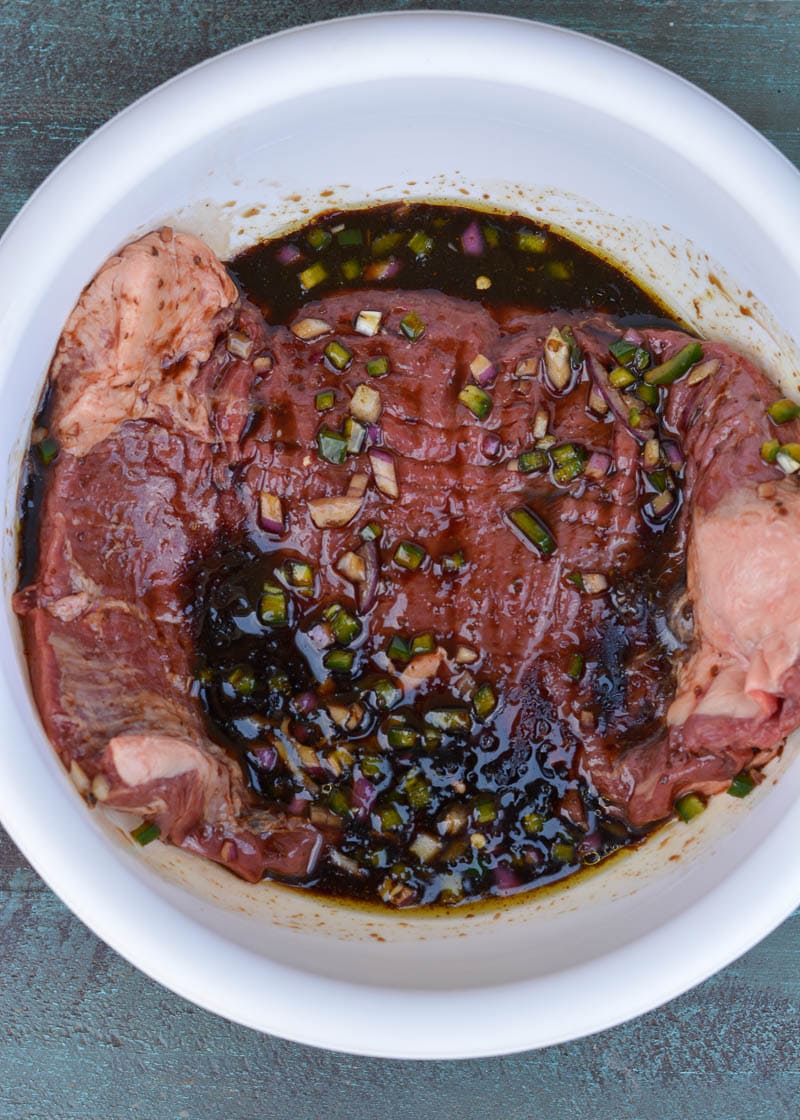 This delicious Marinated Flank Steak is a quick, low carb dish bursting with flavor! Easy keto meal prep recipe for fajitas, tacos, breakfast burritos, and more!