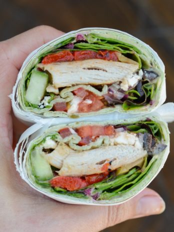 This easy Greek Chicken Wrap is the perfect healthy lunch idea! A soft wrap is loaded with grilled chicken, vegetables, hummus, feta and olives!