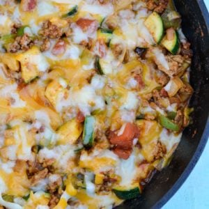 Keto Taco Casserole is the perfect healthy dinner recipe! This low carb dinner is packed with taco meat, zucchini, peppers, onions, tomatoes and cheese! 