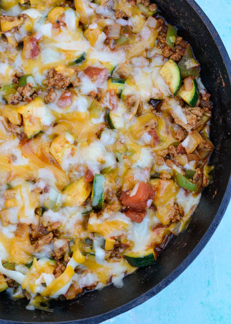 Keto Taco Casserole is the perfect healthy dinner recipe! This low carb dinner is packed with taco meat, zucchini, peppers, onions, tomatoes and cheese! 