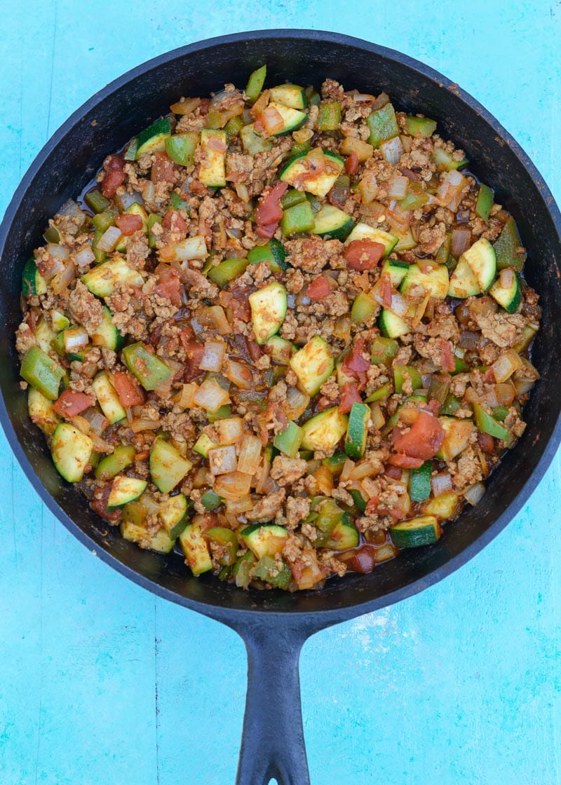 Keto Taco Casserole is the perfect healthy dinner recipe! This low carb dinner is packed with taco meat, zucchini, peppers, onions, tomatoes and cheese! 