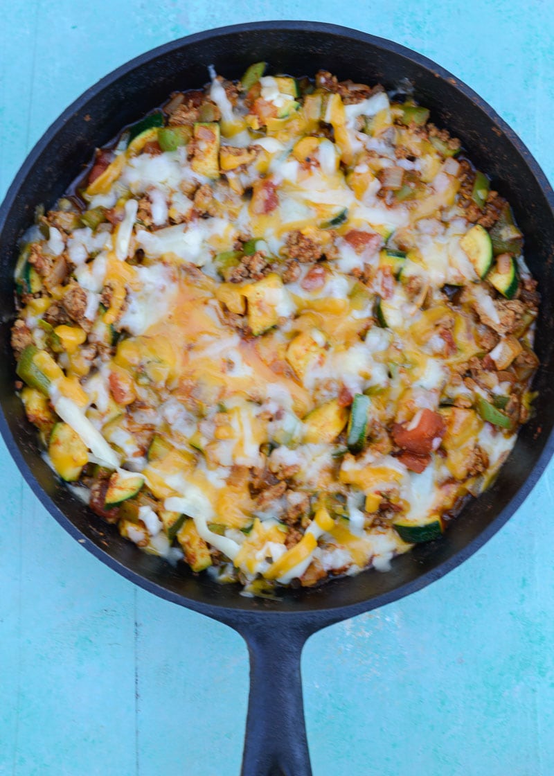 Keto Taco Casserole is the perfect healthy dinner recipe! This low carb dinner is packed with taco meat, zucchini, peppers, onions, tomatoes and cheese! 