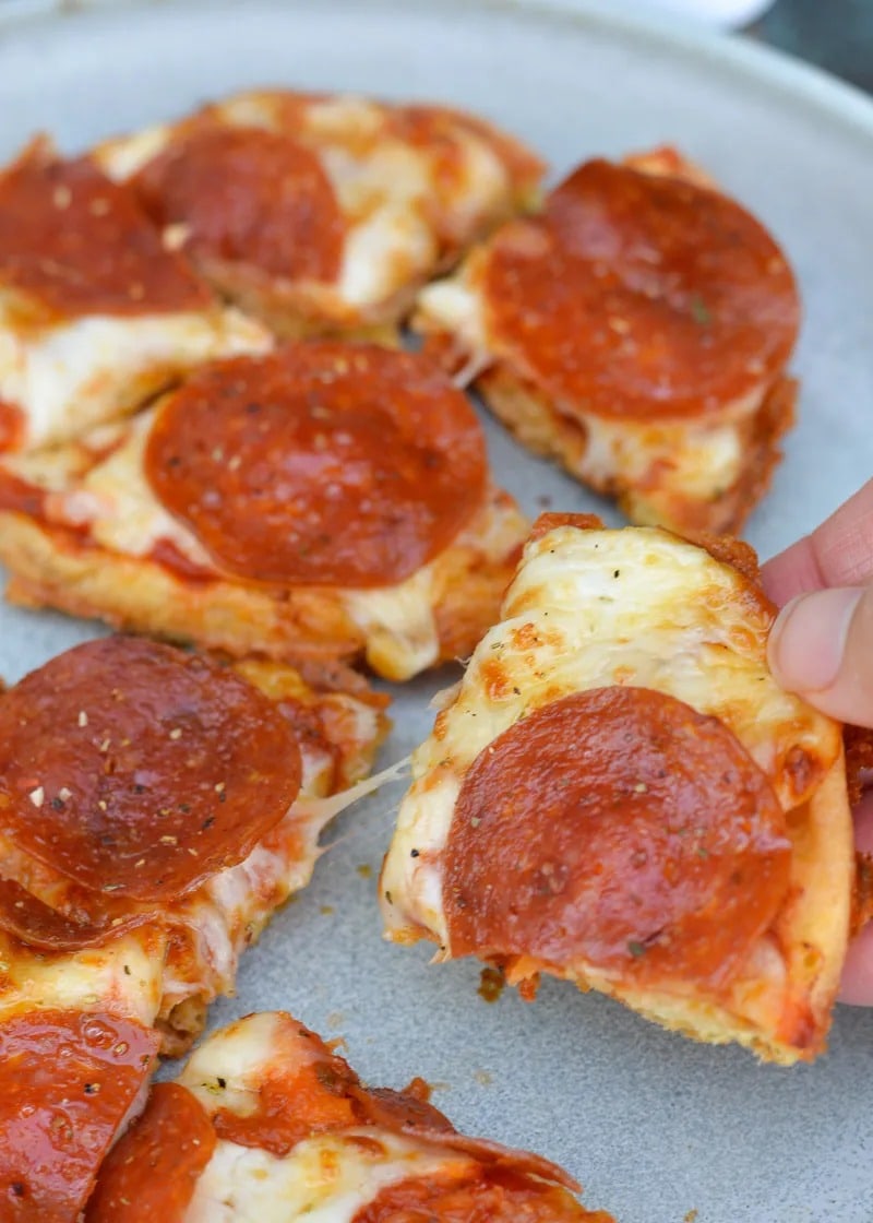 Learn how to make a Pizza Chaffle! This quick and easy keto pizza recipe is perfect for lunches or busy weeknights! Each low carb pizza has just 1.8 net carbs! 