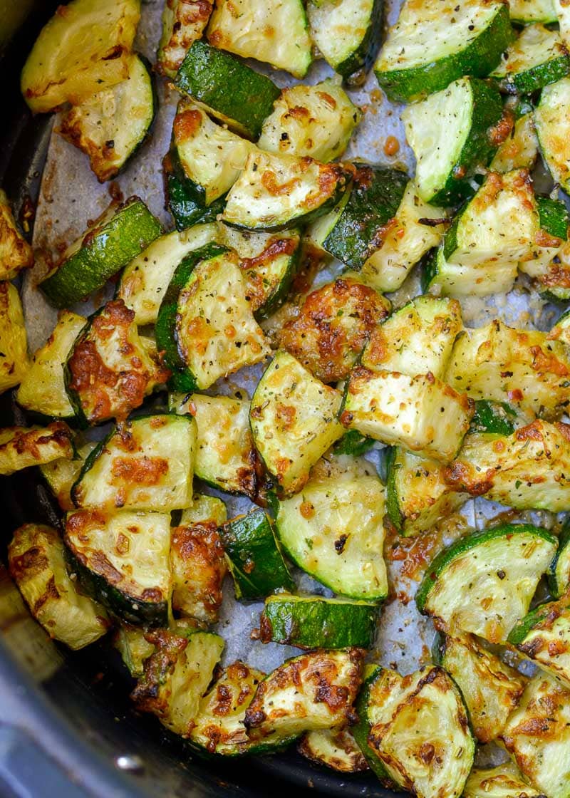 Learn how to make delicious Air Fryer Zucchini with Parmesan! This keto side dish has only four ingredients and is ready in under 10 minutes!