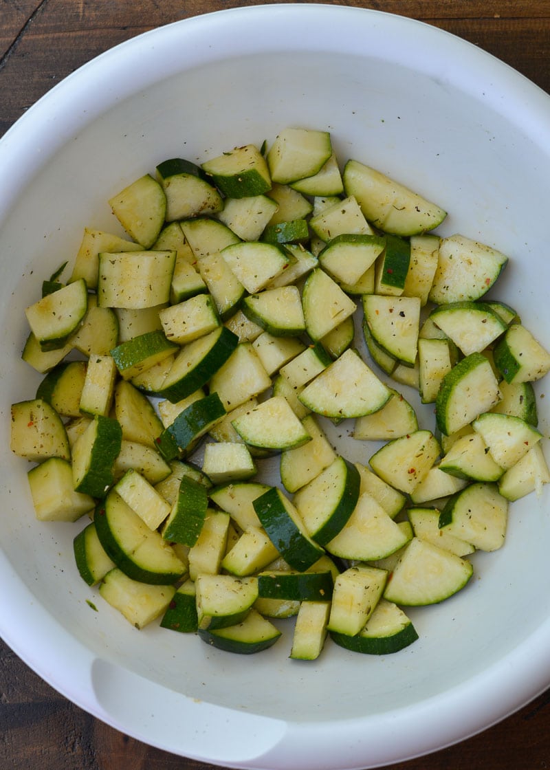 Learn how to make delicious Air Fryer Zucchini with Parmesan! This keto side dish has only four ingredients and is ready in under 10 minutes!