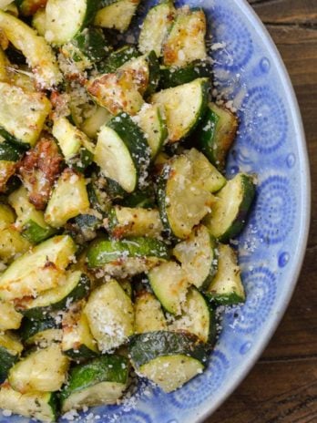 Learn how to make delicious Air Fryer Zucchini with Parmesan! This keto side dish has only four ingredients and is ready in under 10 minutes!