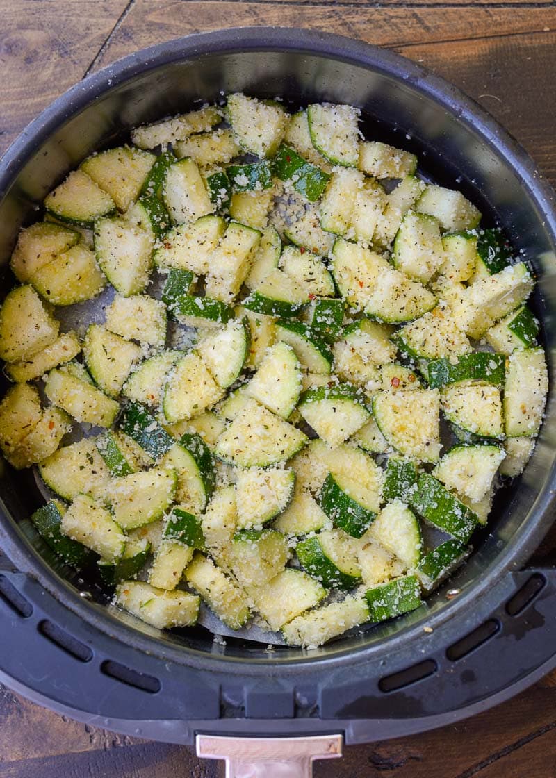 Learn how to make delicious Air Fryer Zucchini with Parmesan! This keto side dish has only four ingredients and is ready in under 10 minutes!