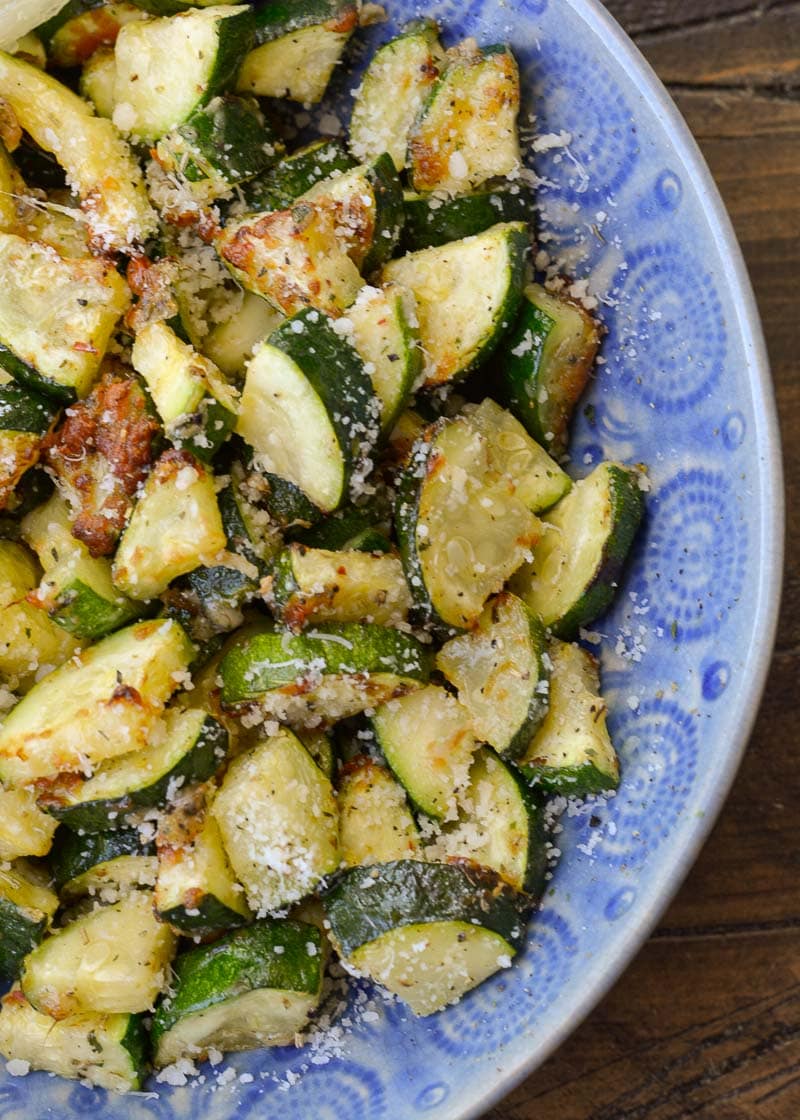 Learn how to make delicious Air Fryer Zucchini with Parmesan! This keto side dish has only four ingredients and is ready in under 10 minutes!