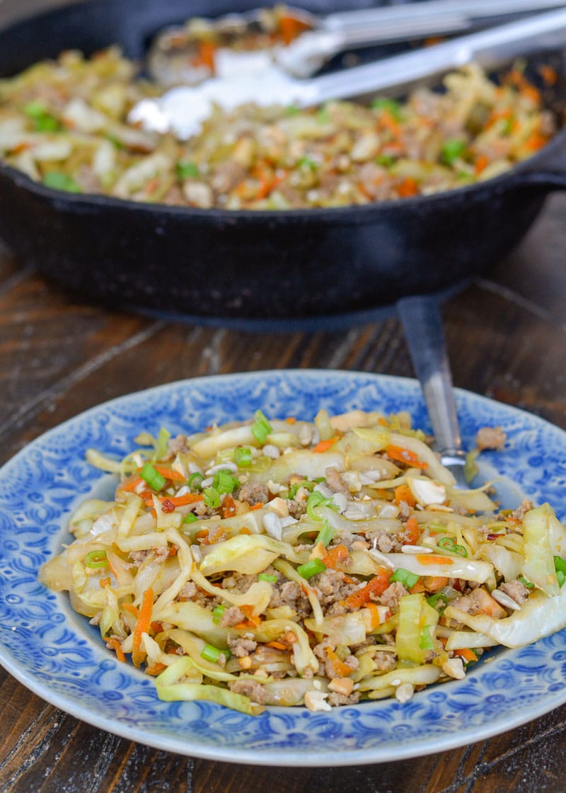 Egg Roll in a Bowl is an easy, healthy dinner that is ready in under 20 minutes! This easy pork stir fry recipe is loaded with meat, vegetables and a sesame sauce. 