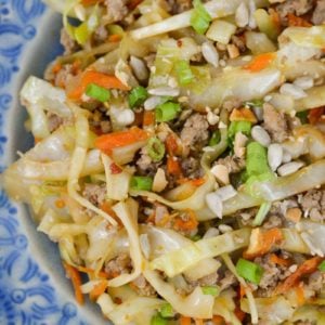 Egg Roll in a Bowl is an easy, healthy dinner that is ready in under 20 minutes! This easy pork stir fry recipe is loaded with meat, vegetables and a sesame sauce. 